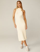 white ribbed mock neck tank top midi dress with a front side slit.